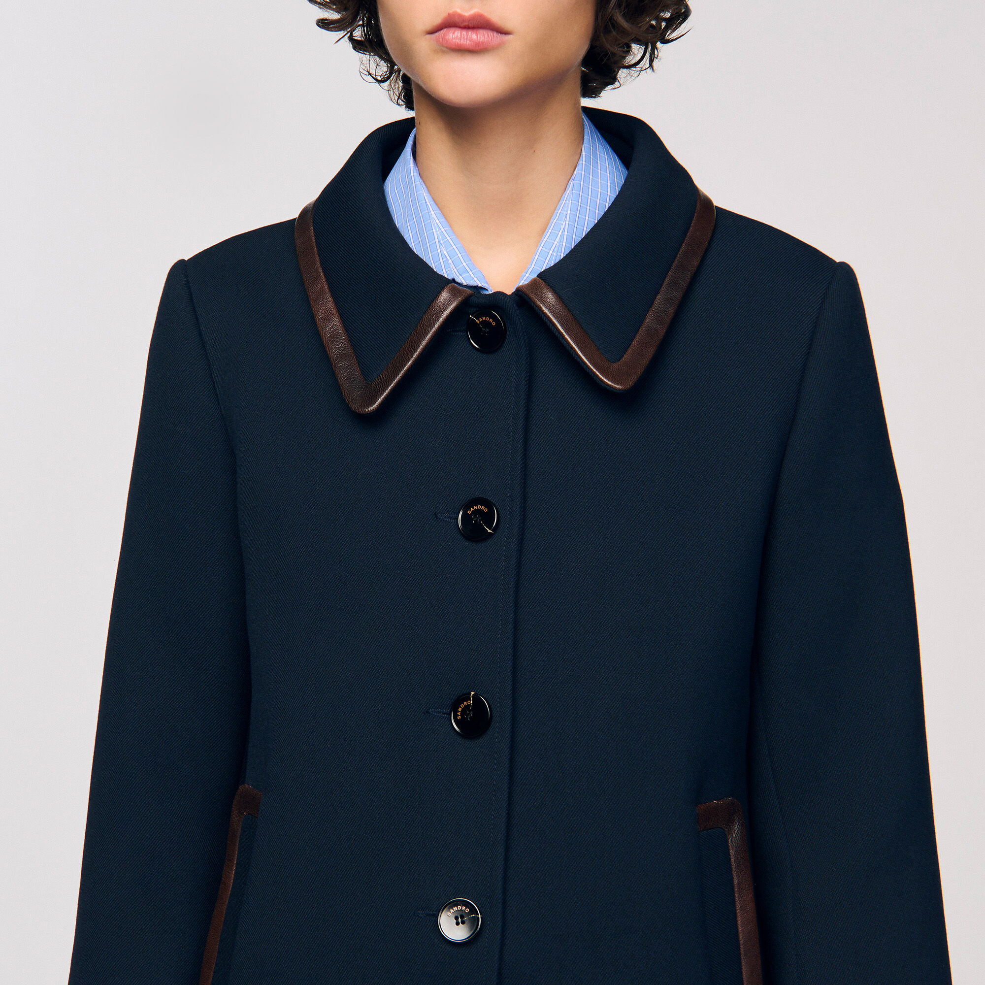 Manteau avec finitions en cuir