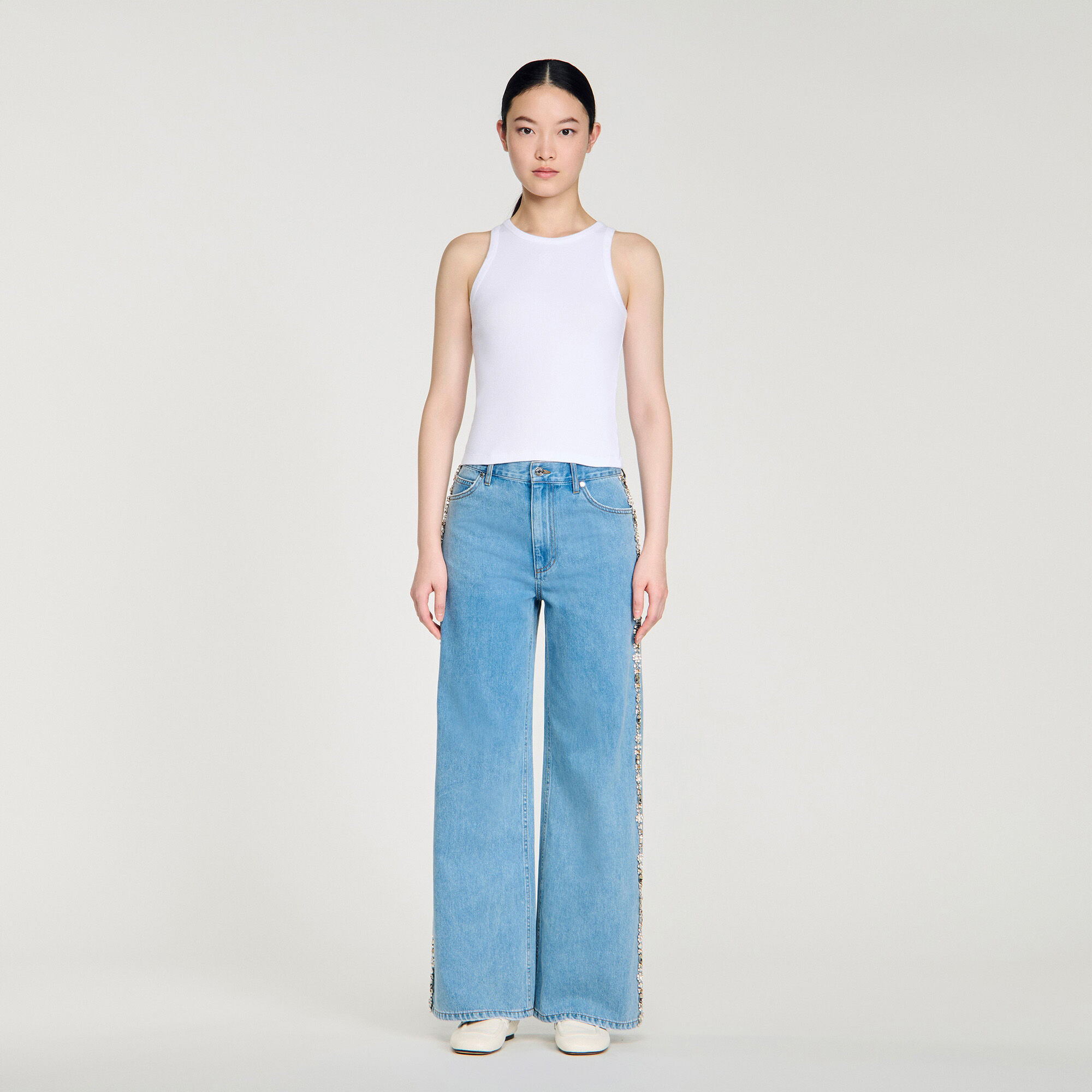 Jean skinny à strass délavé
