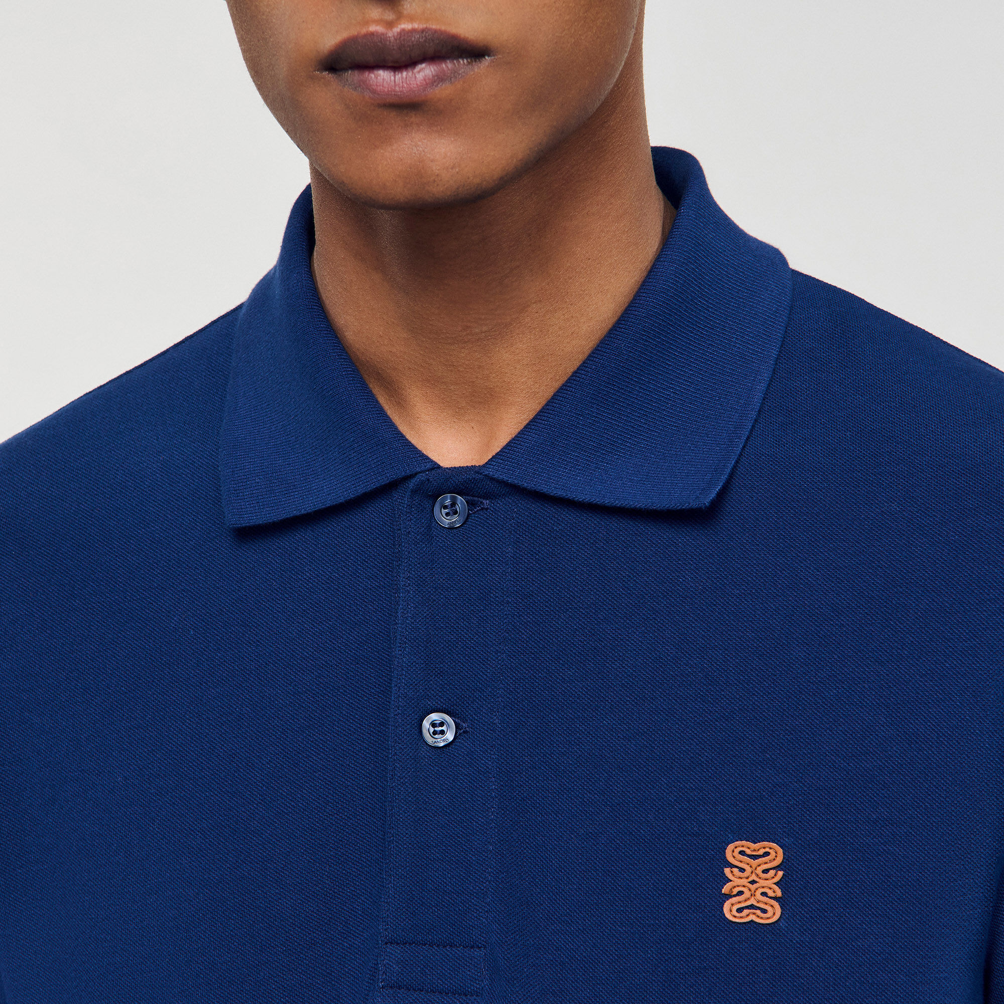 Chemise polo avec logo en cuir