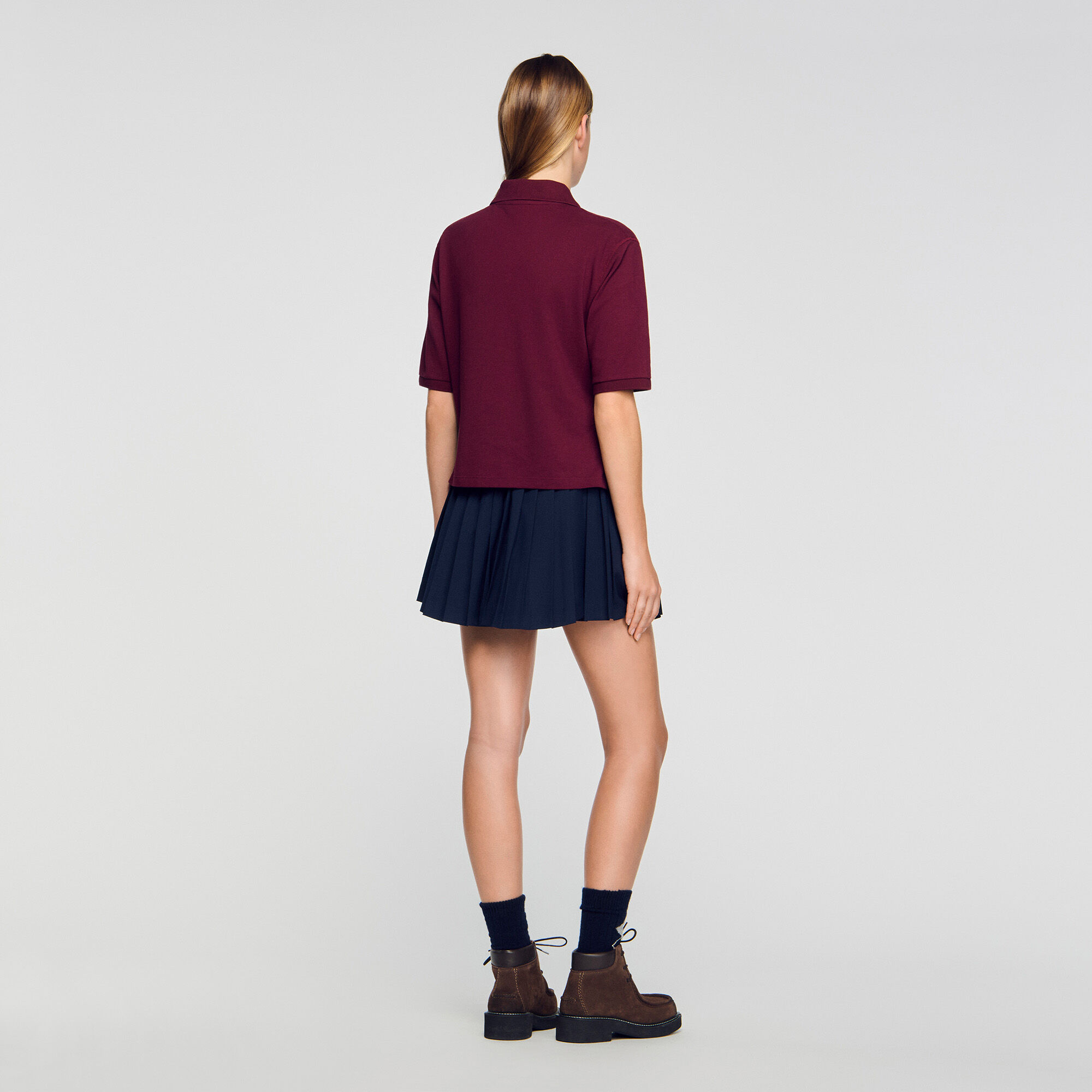Chemise polo à boutons décoratifs